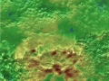 Na tomto 3D topografickém snímku lze vidět, že dvě hory, prozatímně pojumenované Wright Mons a Piccard Mons, jsou zřejmě ledové vulkány - kryovůlkány. Barvy zvýrazňují výškové rozdíly - modrá barva indikuje nejníže položené oblasti, vyšší jsou zelené a nejvyšší hnědé